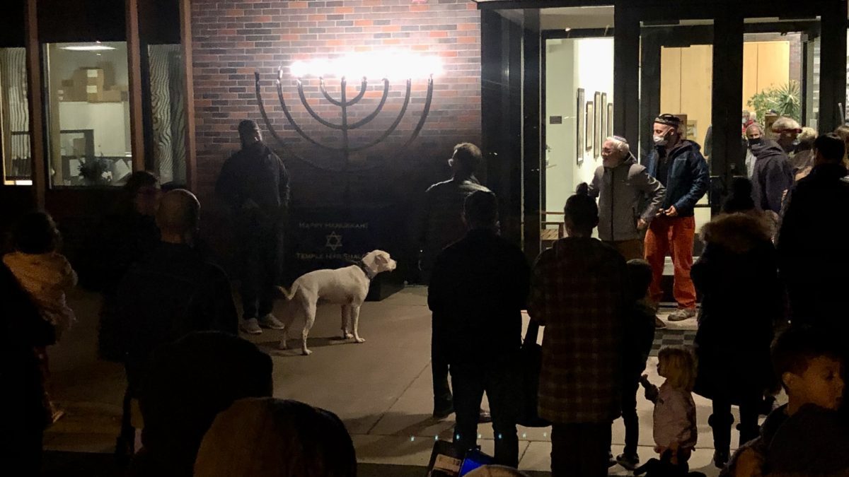 Gus the dog evn got in on the community'd celebration and candle lighting of the giant outdoor Hannukah menorah this year.