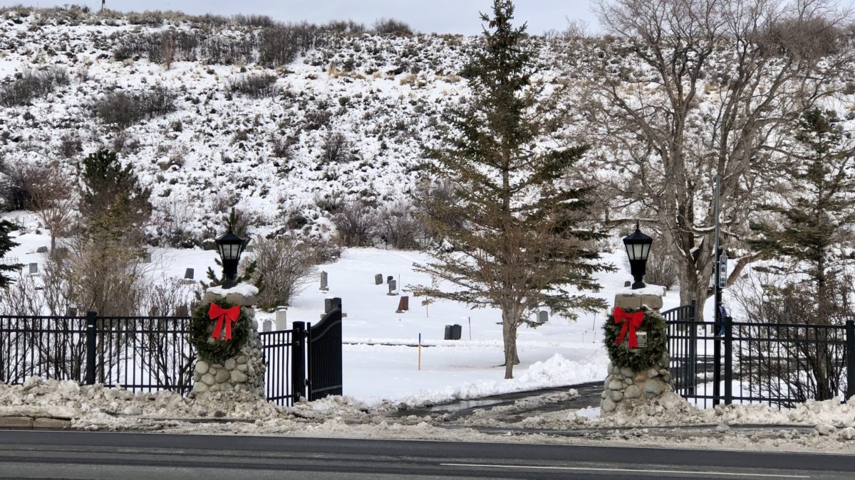 Christmas wreaths and ribbons adorn the entrance of the Park City Cemetery.