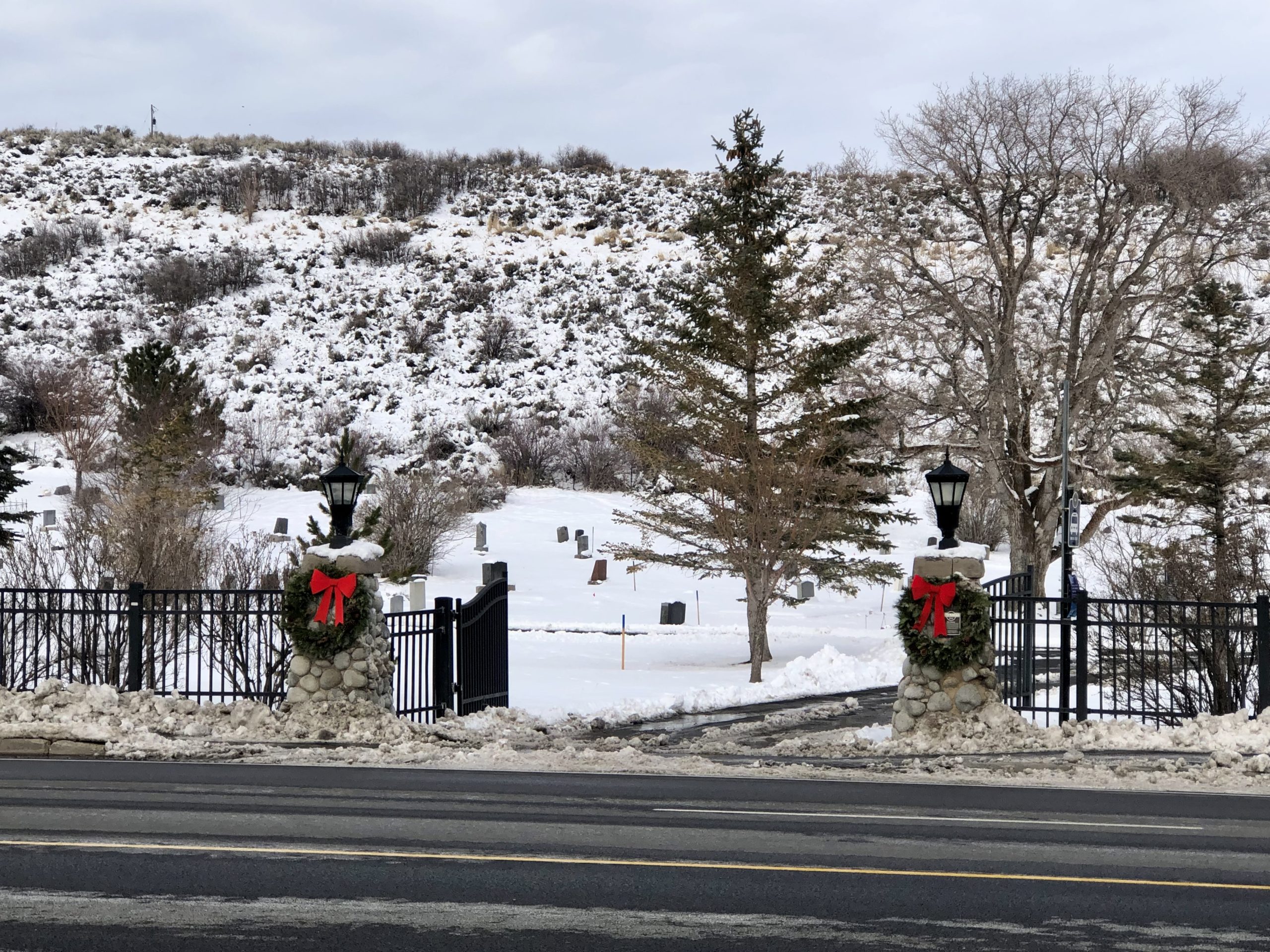 Christmas wreaths and ribbons adorn the entrance of the Park City Cemetery.