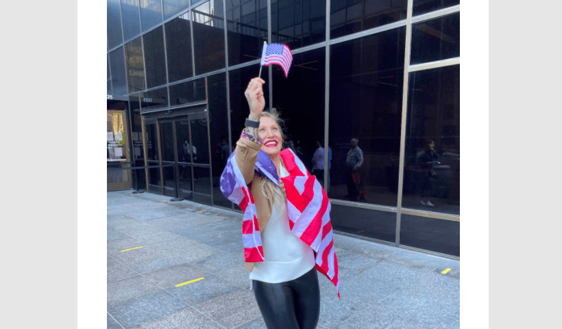 Kaillie Humphries waving an American fllag for the country she hopes to represent in the 2022 Beijing Olympic Games.