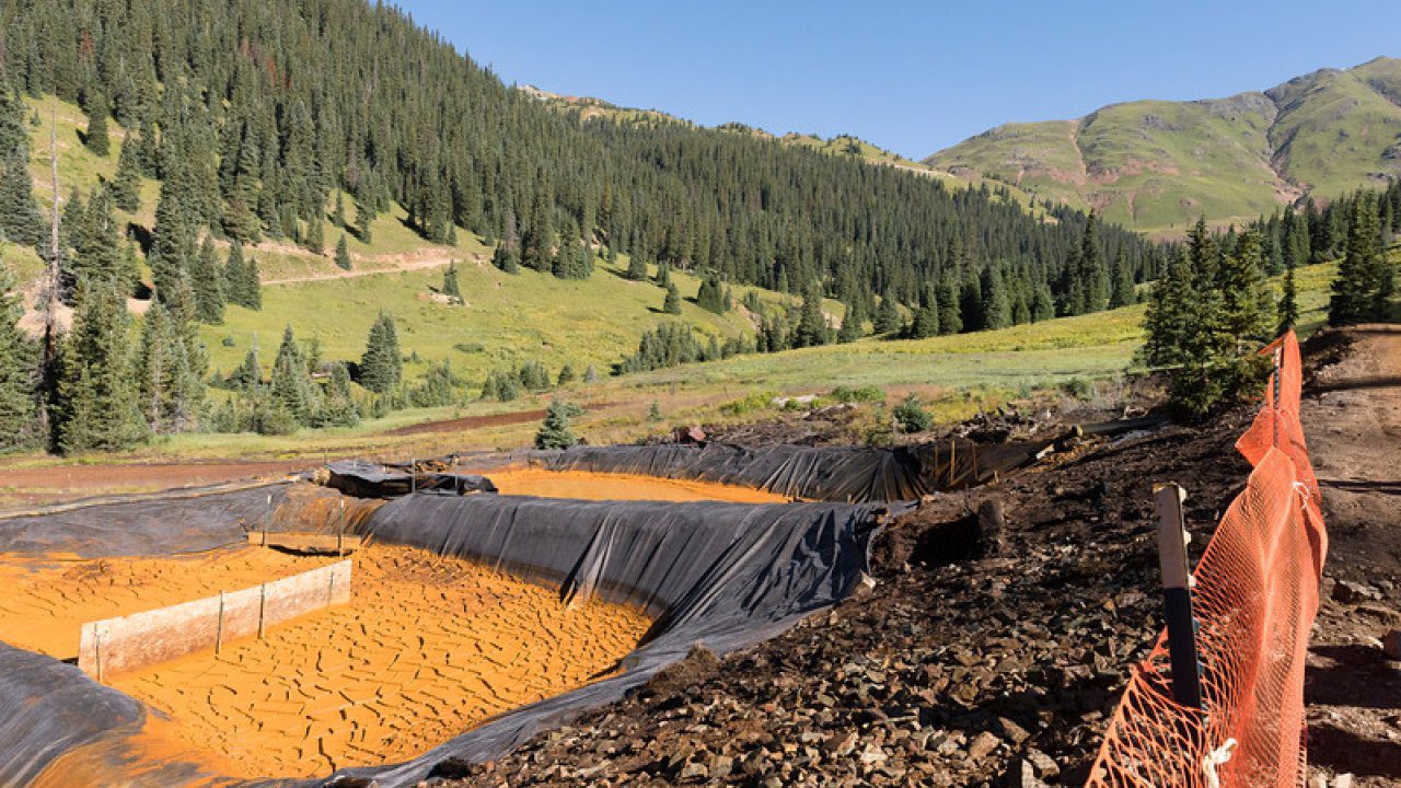 Settling ponds used to precipitate iron oxide and other suspended materials from nearby Red and Bonita mines drainage are shown in this photo.