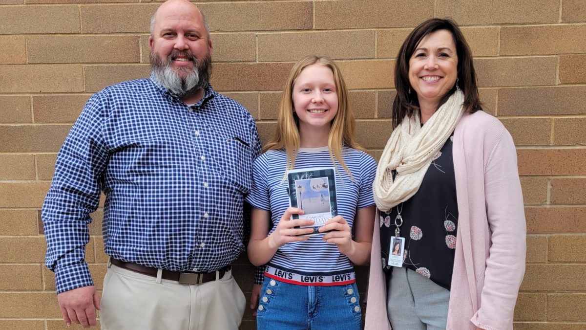 Pictured left to right: South Summit School District Superintendent Greg Maughan, 8th grade student Ellery S., South Summit Middle School Principal Kena Rydalch.