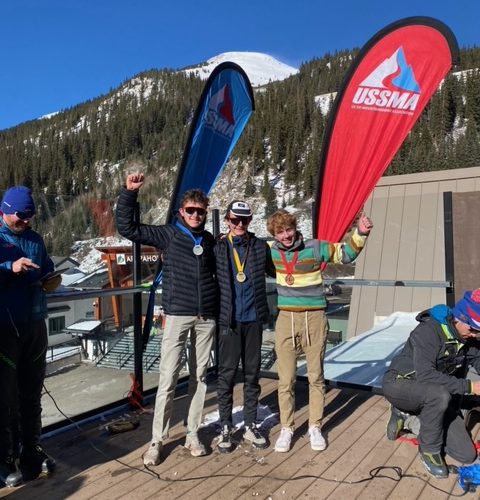 1st, 2nd, and 3rd place Skimo finishers on the podium representing Park City Ski and Snowboard in Colorado.