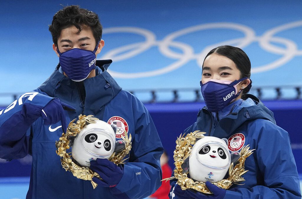 Silver medalists Karen Chen and Nathan Chen pose for a photo after the team event in the figure skating competition at the 2022 Winter Olympics, Monday, Feb. 7, 2022, in Beijing.