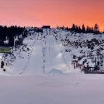 Sun sets behind the ski jumps at the Utah Olympic Park. Venues like the UOP will host more events in 2034 than they did at the 2002 Games. Ski Jumping is a good axample of this as women's ski jumping was not a part of the 2002 Olympics.