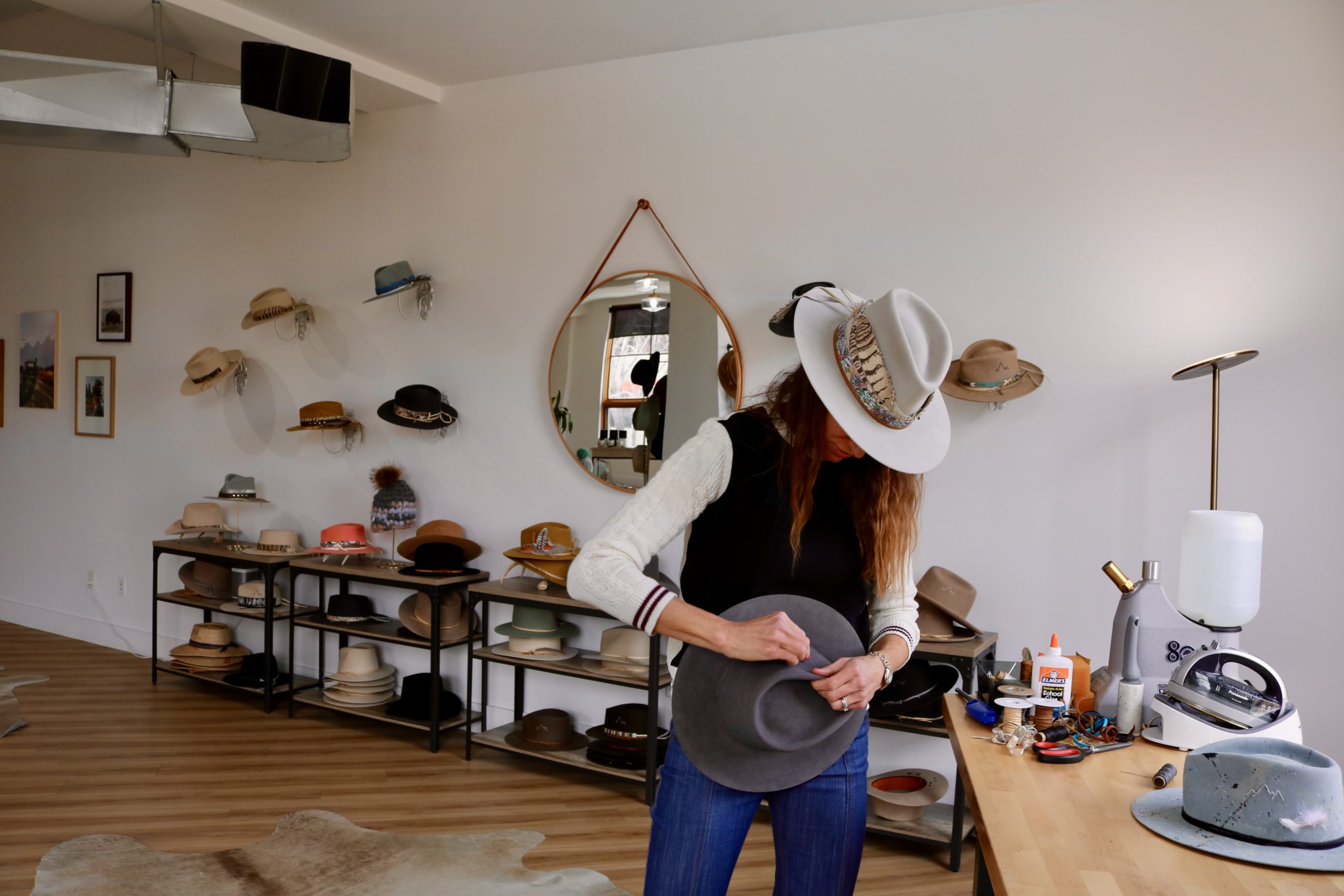 While Sarah makes the hats, Lara still gets creative by hand-stitching the mountain logo, adding bands and accessories, and fire-distressing hats.