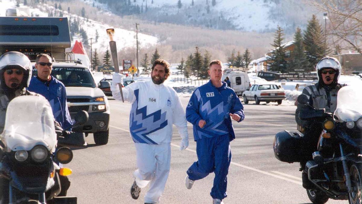 Parkite Myles Rademan carries the torch at the 2002 Winter Olympic Games.