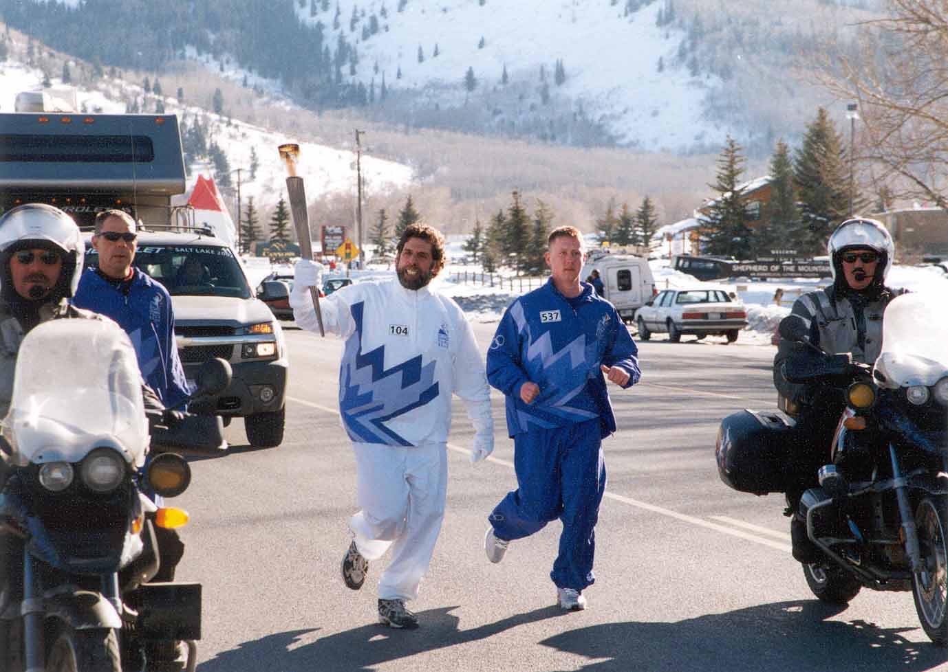 Parkite Myles Rademan carries the torch at the 2002 Winter Olympic Games.