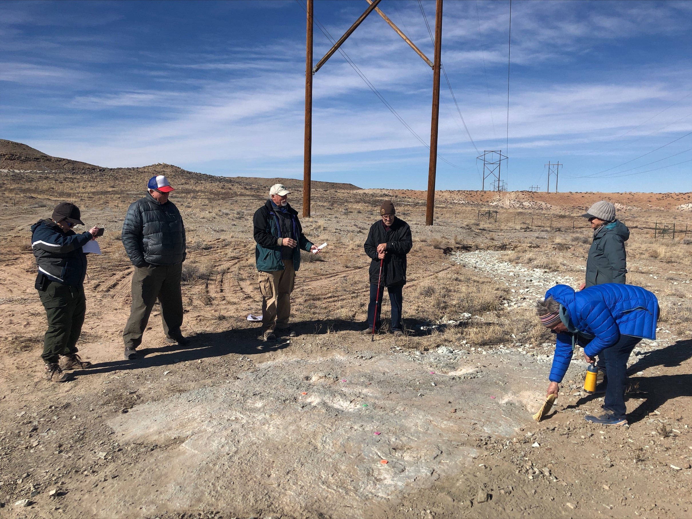 Members of the Utah Friends of Paleontology Moab-based Gastonia Chapter and a BLM paleontologist visit the Mill Canyon Dinosaur Tracksite on Saturday, February 5.