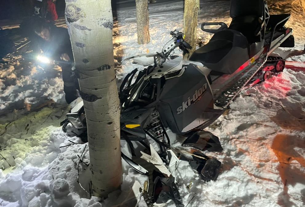 A 65-year-old man riding a snowmobile collided with a tree on Sunday.