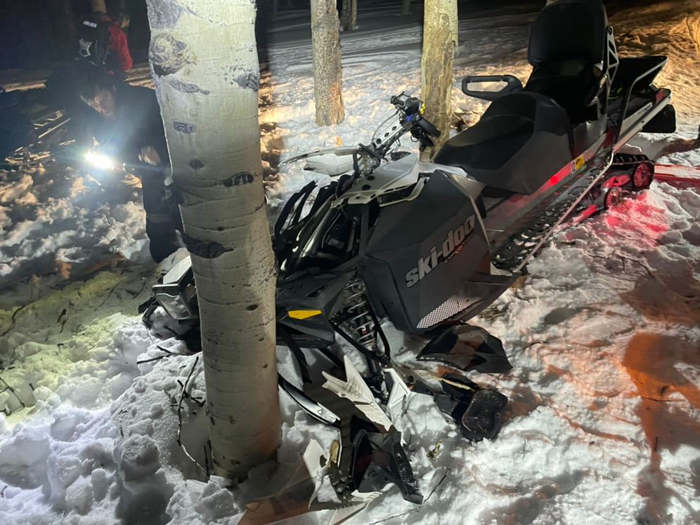 A 65-year-old man riding a snowmobile collided with a tree on Sunday.