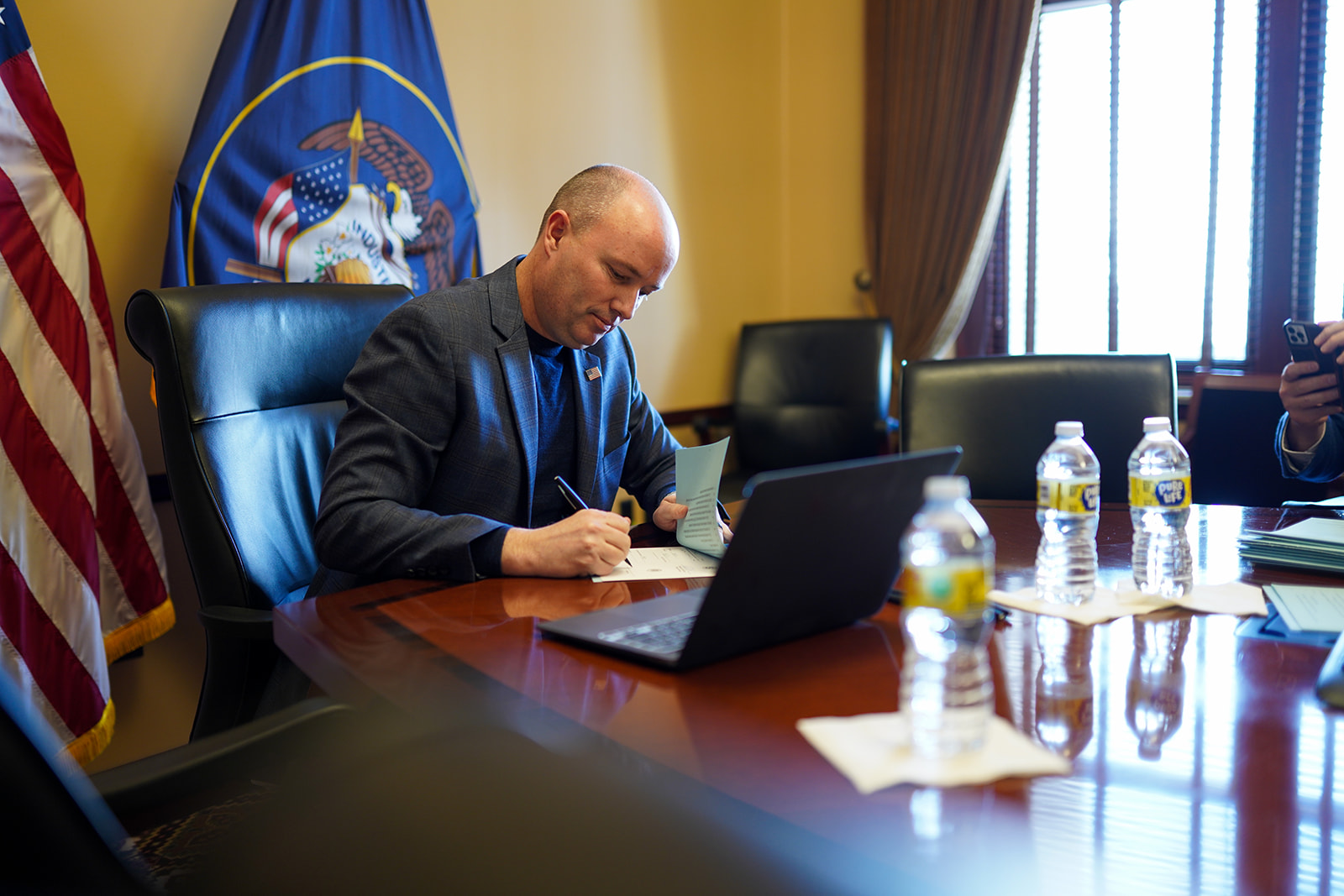 Utah Gov. Spencer Cox signing a bill on Monday that does not relate to transgender athletes.