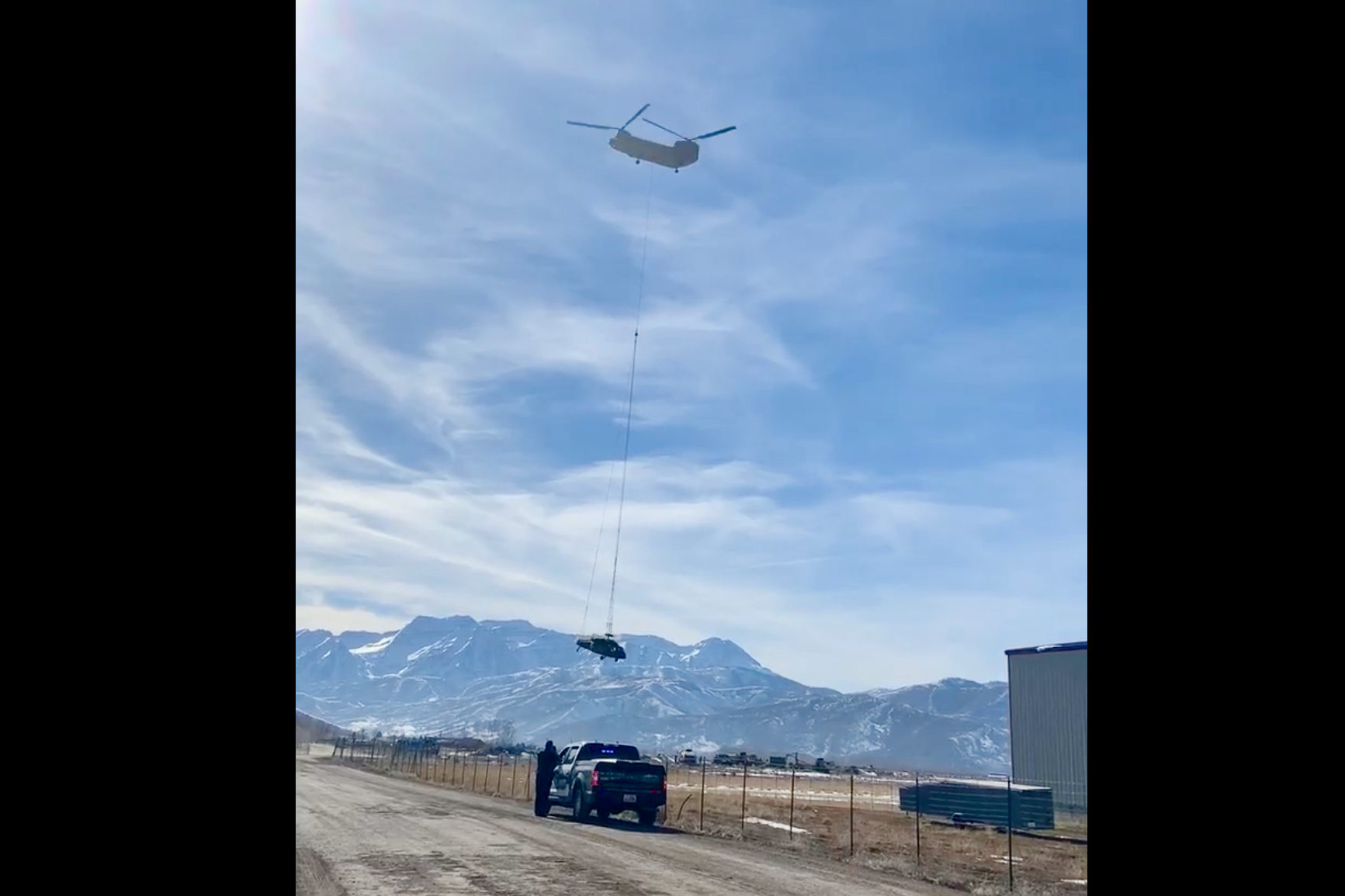 A Chinook helicopter from the Army National Guard transporting one of the UH-60 Black Hawks that crashed near Snowbird last week.