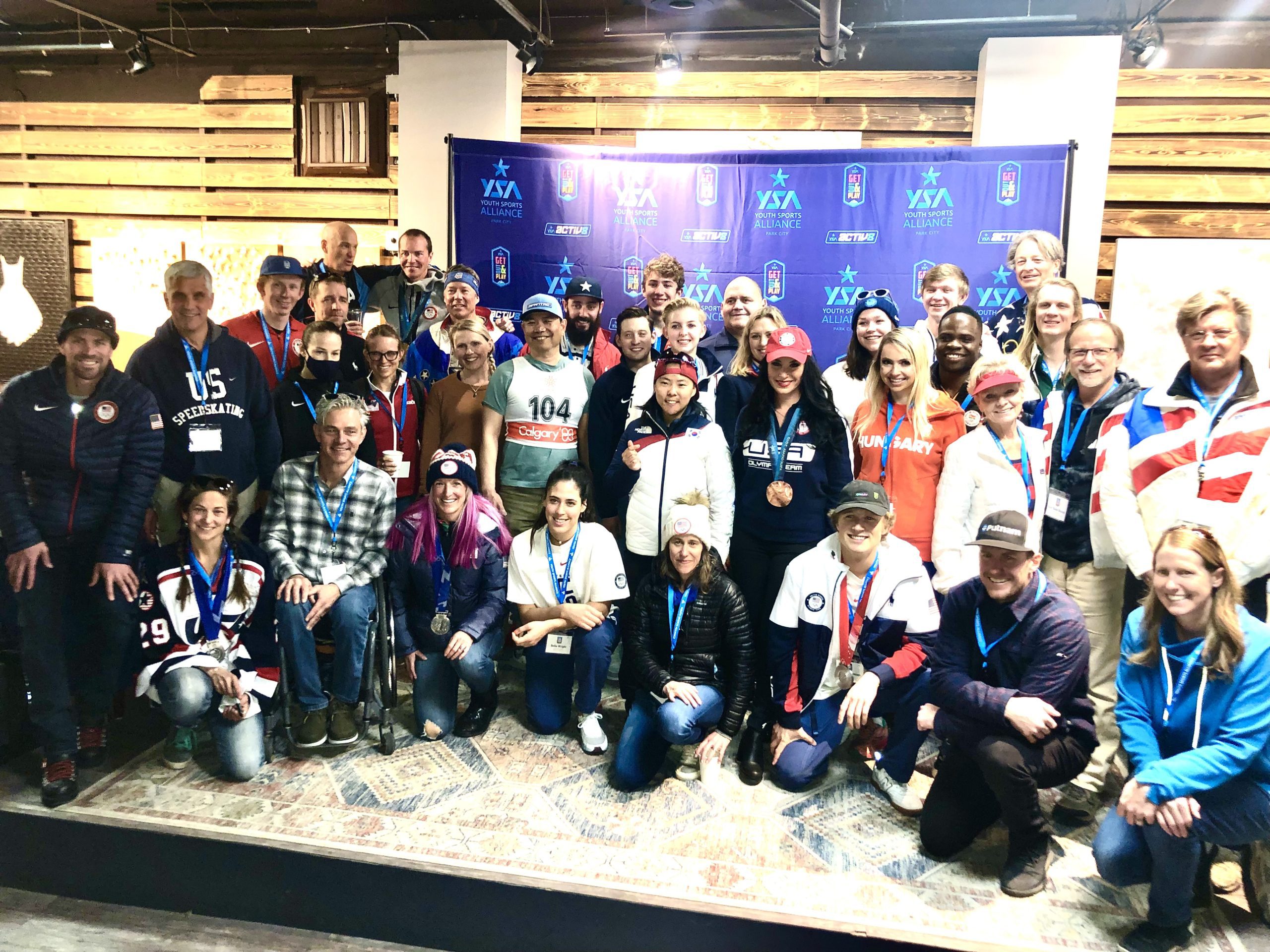 Youth Sports Alliance's Olympic parade down Main St. gathered these 36 Olympians including speedskater Casey Dawson who just won a gold this weekend in Salt Lake City's World Cup.