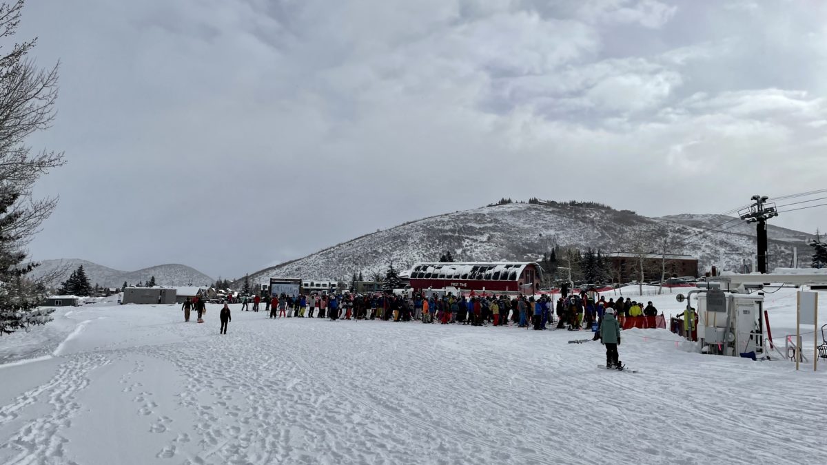 Skiers and riders wait for opening at the base of the Eagle Lift in March.