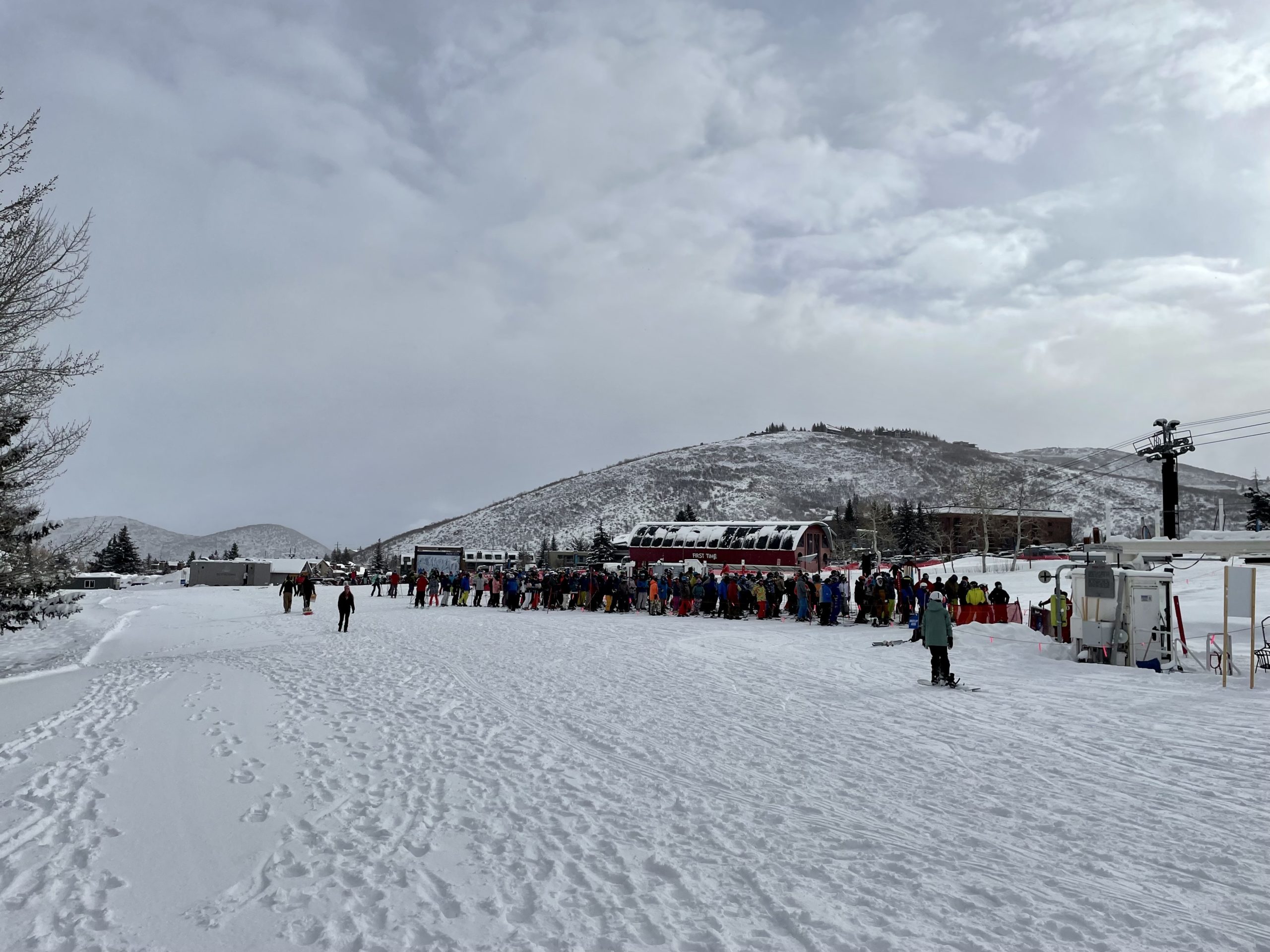 Skiers and riders wait for opening at the base of the Eagle Lift in March.