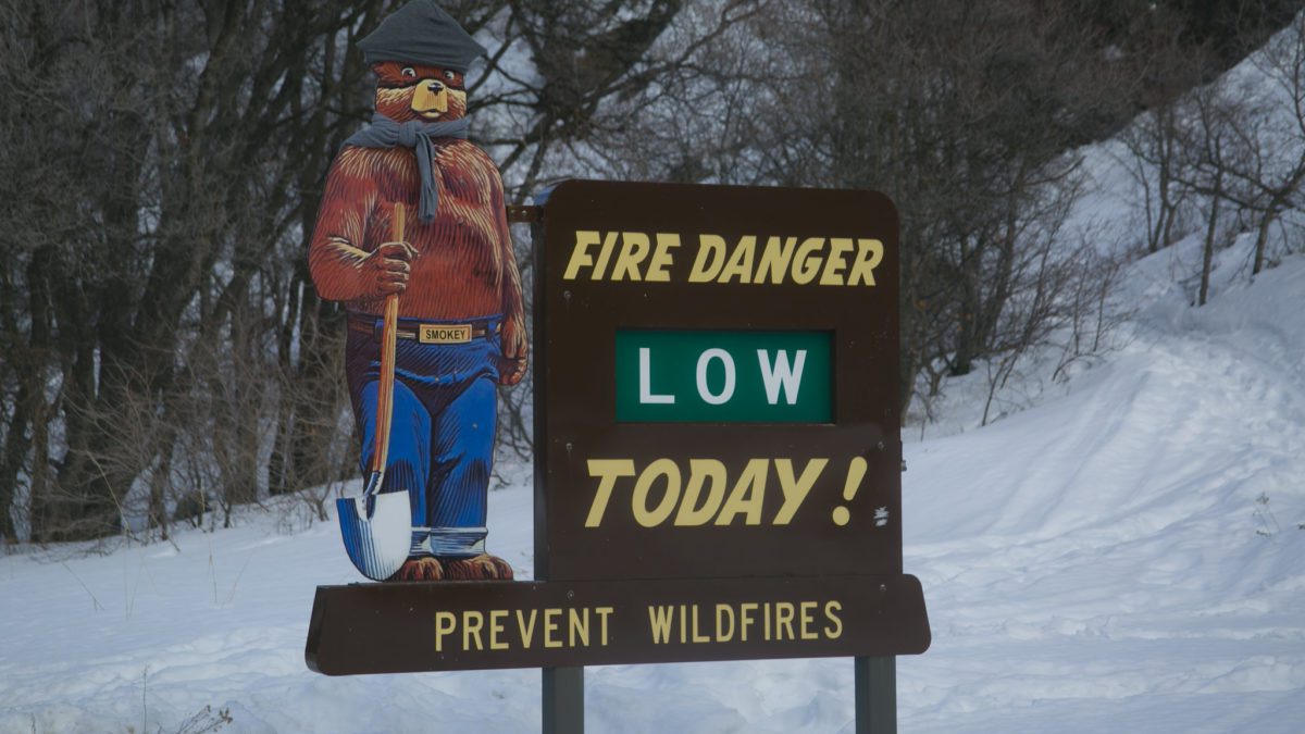 Smokey Bear Fire Danger sign in winter