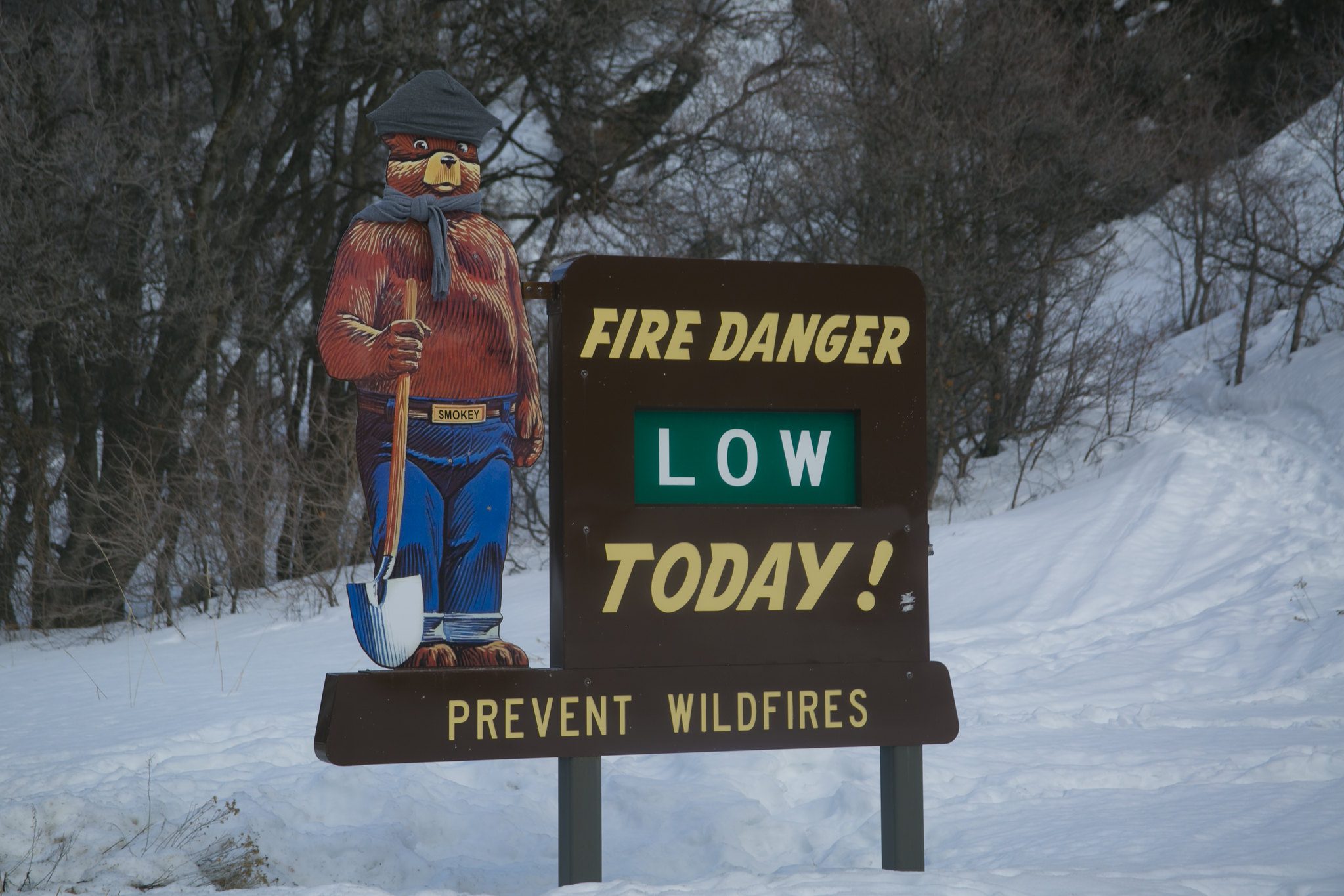 Smokey Bear Fire Danger sign in winter