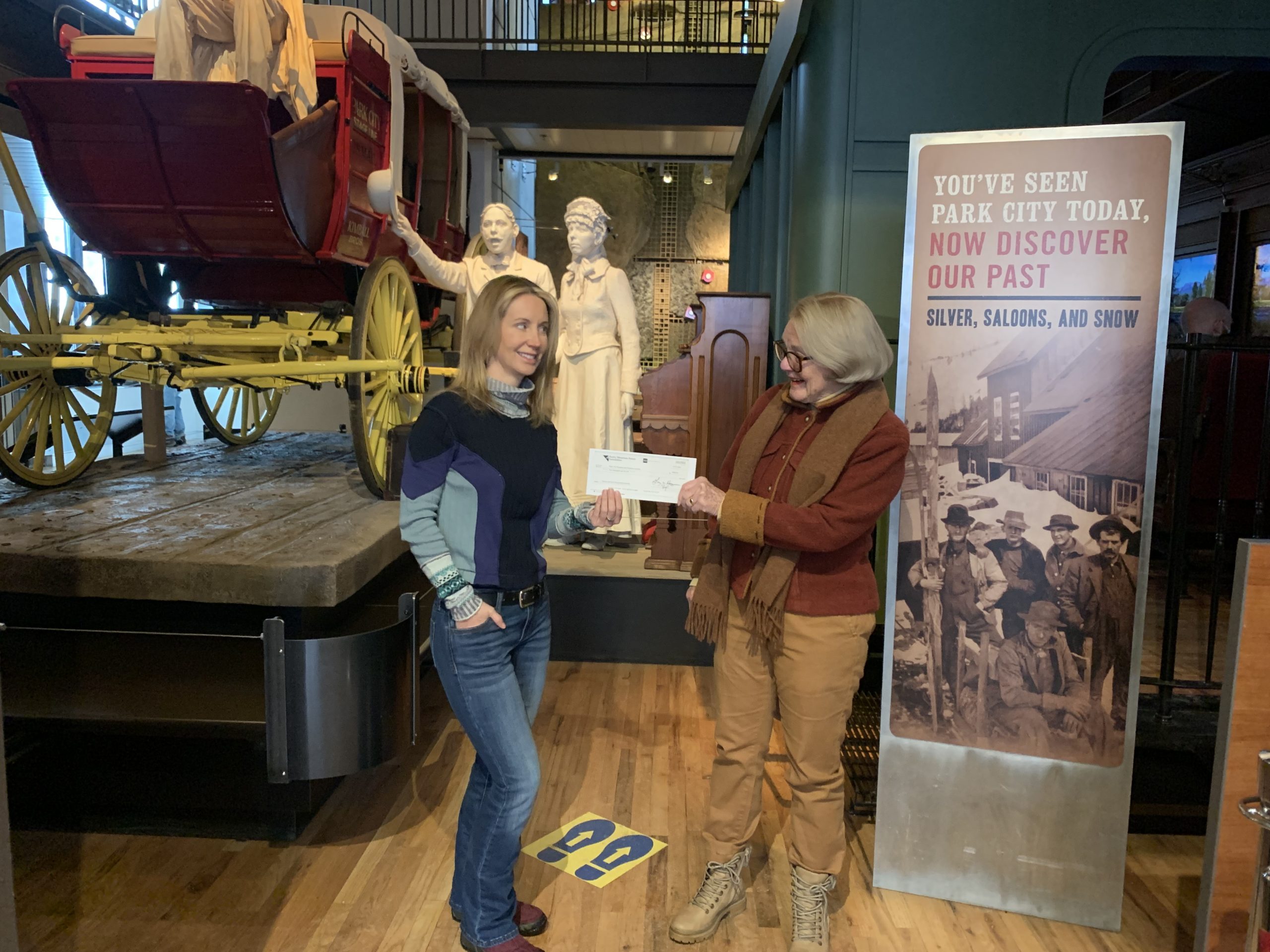 (left) Rocky Mountain Power Foundation Community Business Manager Lisa Romney and (right) Friends of Ski Mountain Mining History Co-Chair Sally Elliott.