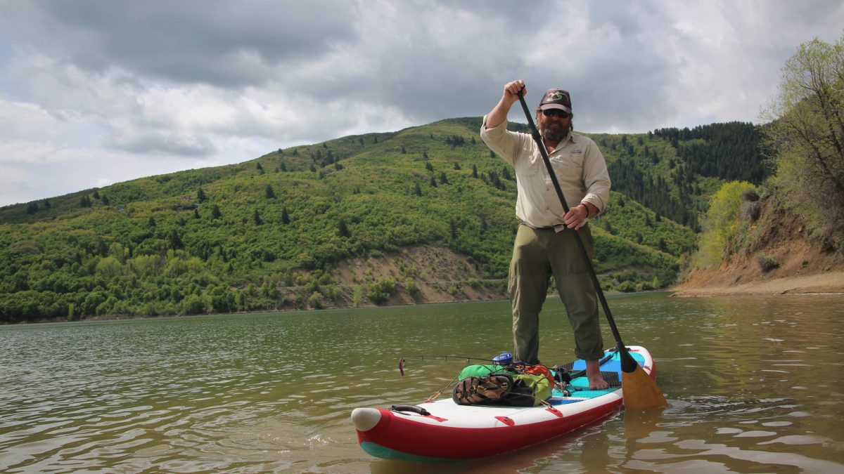 Man paddleboarding on Pineview Dam