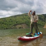 Man paddleboarding on Pineview Dam