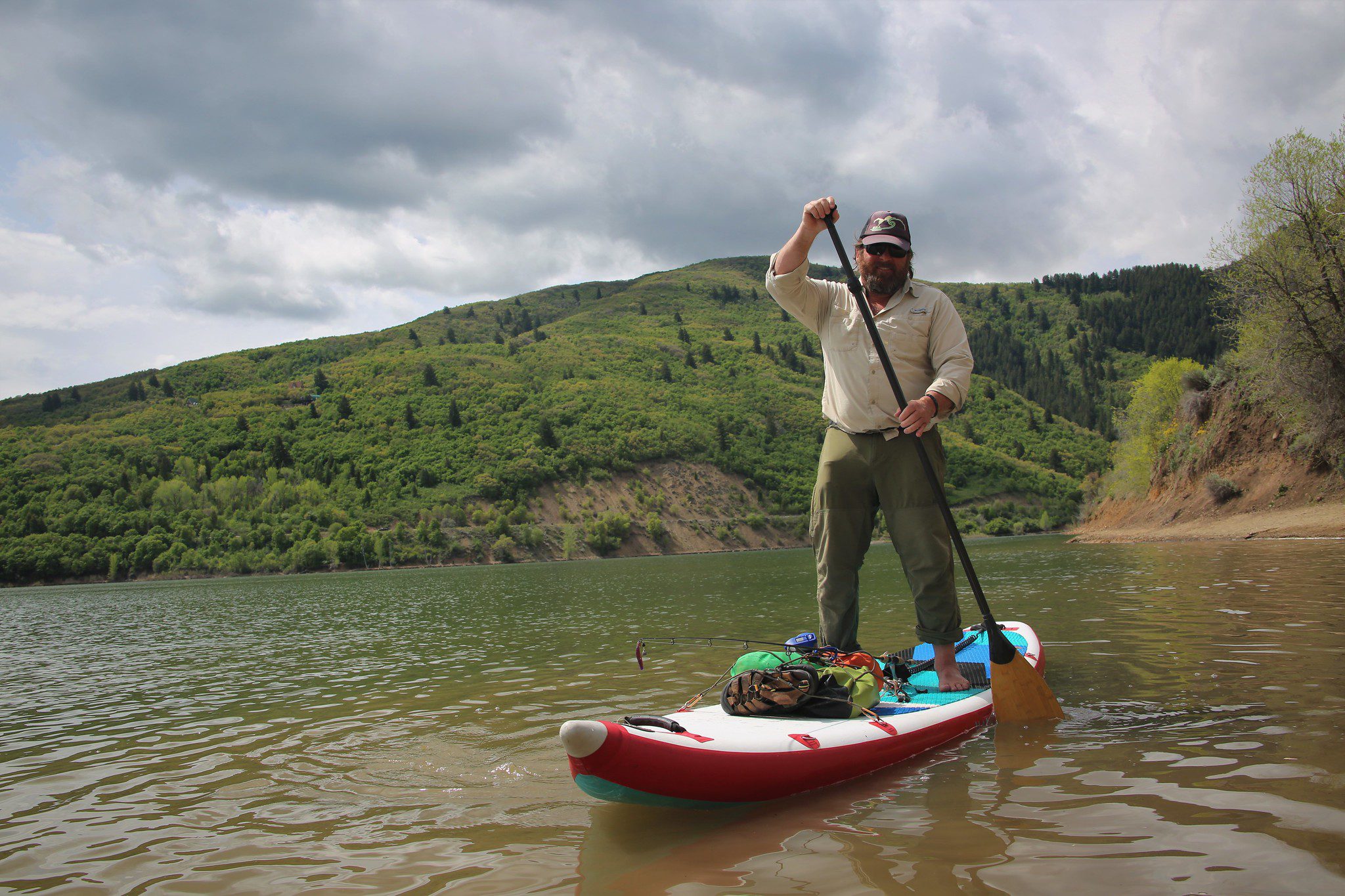 Man paddleboarding on Pineview Dam
