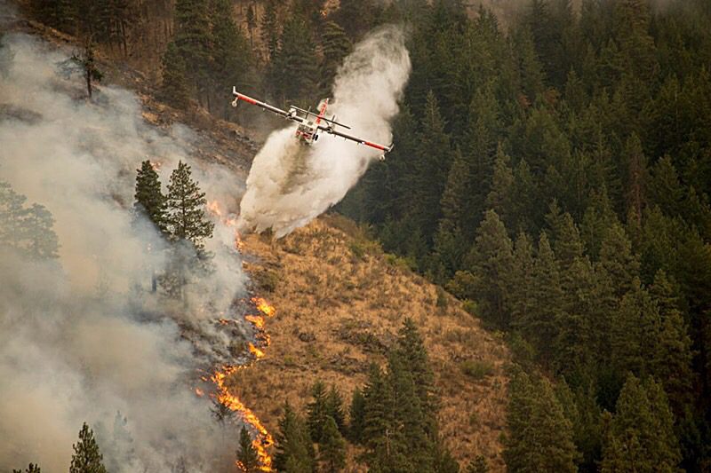 Wildfire scooper dropping water.