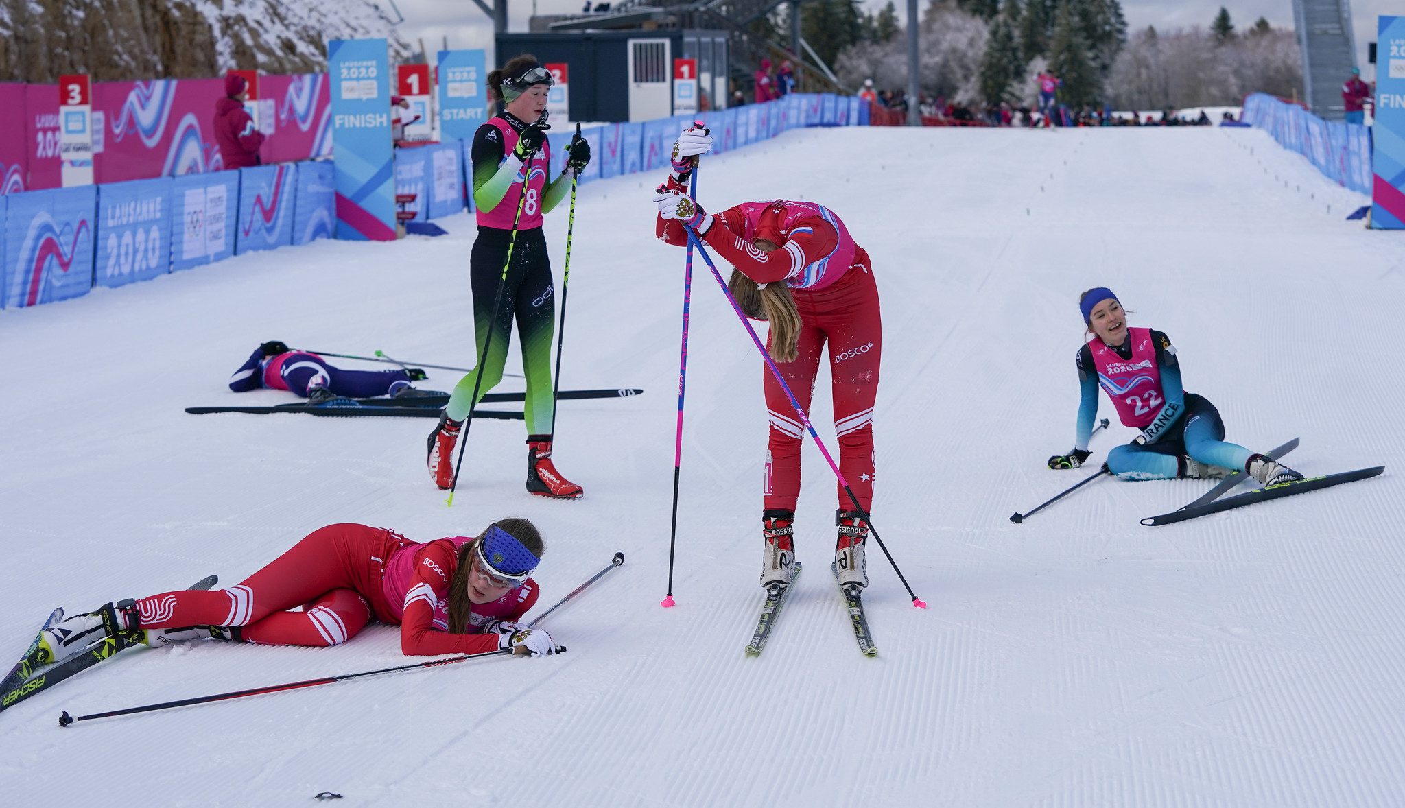 Athletes who just crossed the finish line in the Women's Nordic Combined event at the Lausanne 2020 Youth Olympic Games.