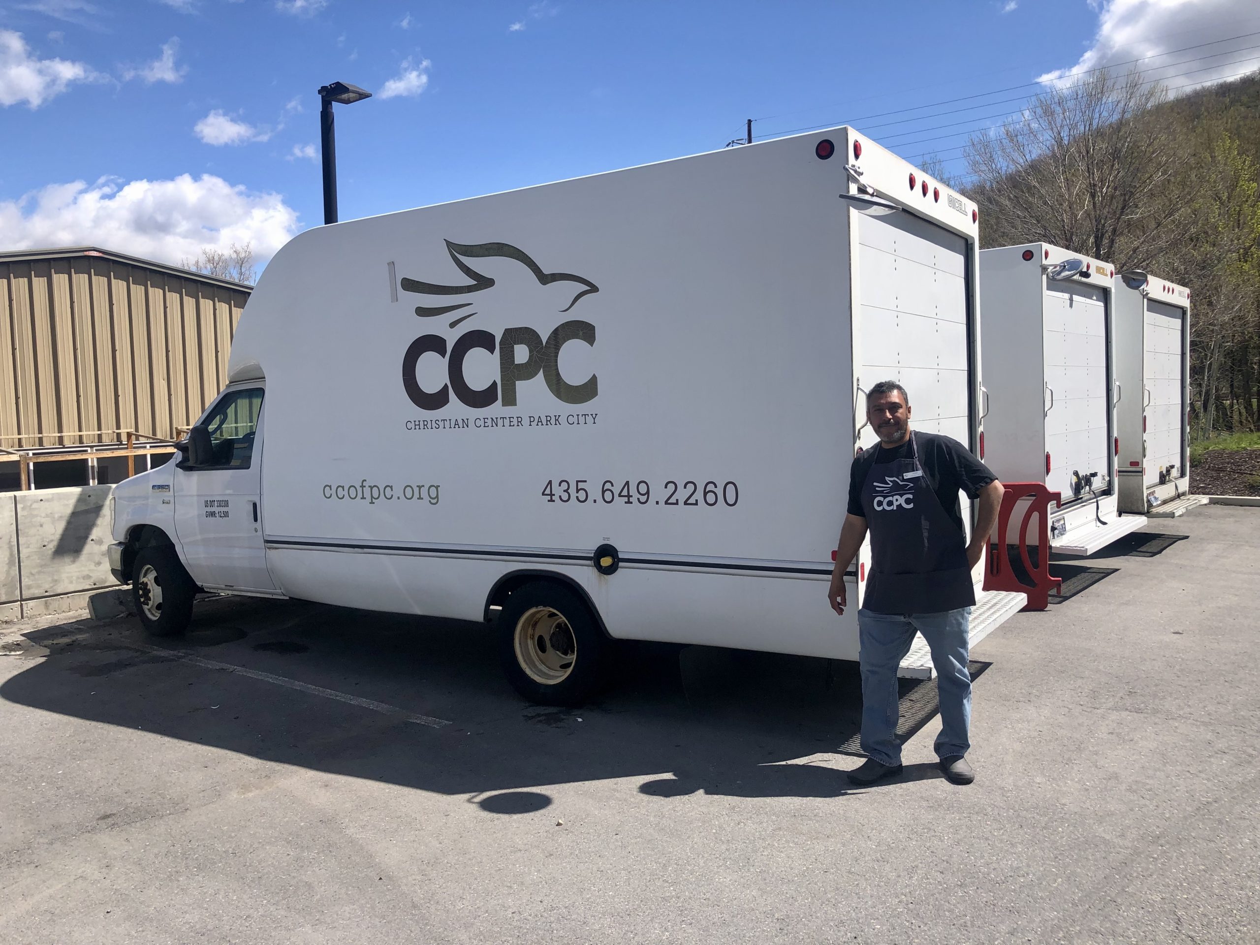 Manager Jaime Mira with the trucks he drives around Summit County.