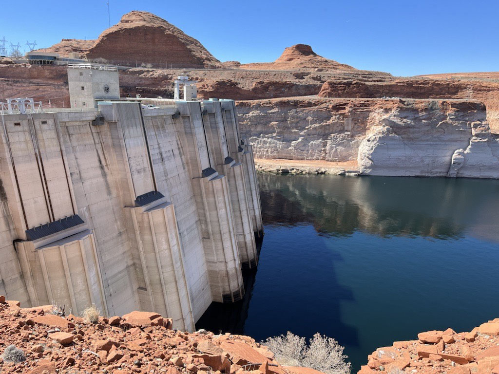 The Glen Canyon Dam in April 2022. Federal water officials have announced that they will keep hundreds of billions of gallons of Colorado River water inside Lake Powell instead of letting it flow downstream to southwestern states and Mexico.