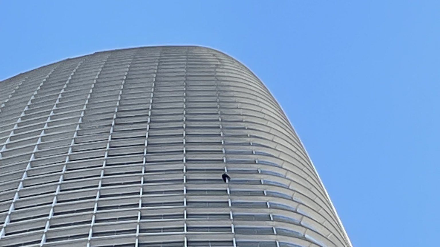 Maison Des Champs, who goes by 'Pro-Life Spiderman,' climbing the steel frame of the Salesforce Tower in downtown San Francisco.