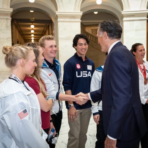 Parkite Nick Page shakes hands with Utah Senator Mitt Romney on Wednesday.