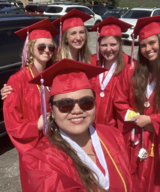 Madie Ho, Samantha Staub, Zoë Clancy, Isabel Lückan, and Emma Ratkovic celebrate their high school graduation.