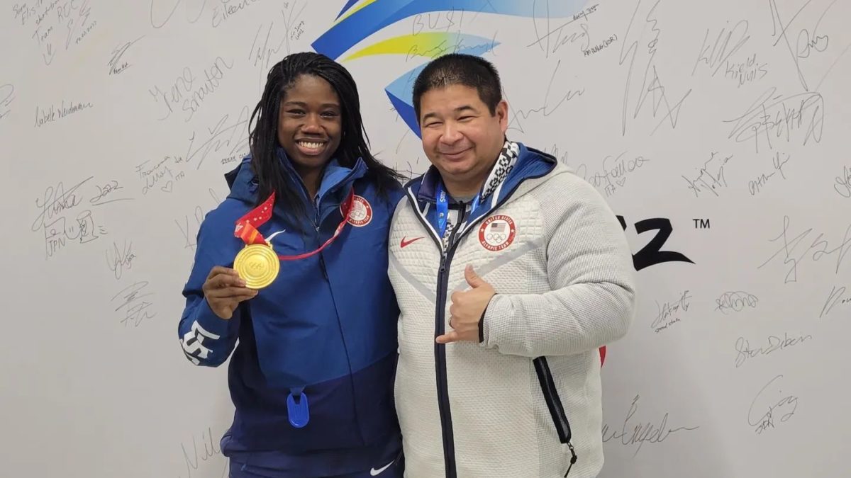 US Speedskating Coach Ryan Shimabukuro with Salt Lake City's Erin Jackson at the Beijing Winter Games.