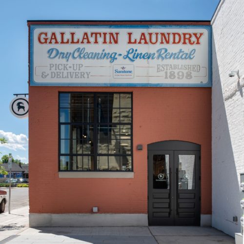 The old Gallatin Laundry sign on the new Backcountry retail store in Bozeman, MT.