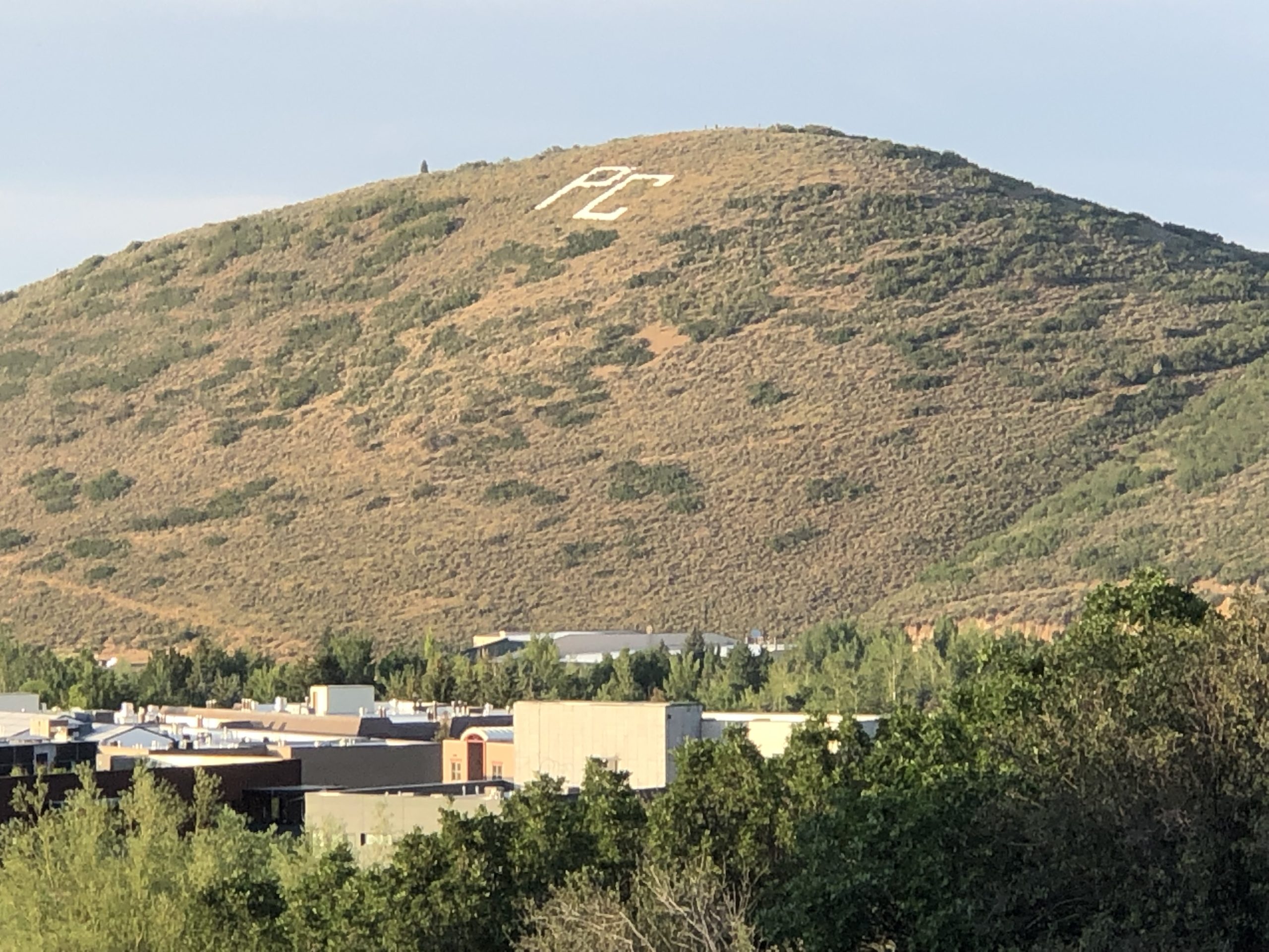 PC Hill behind an Elementary School, the Junior High, the High School, and the administrative building for the Park City School District.