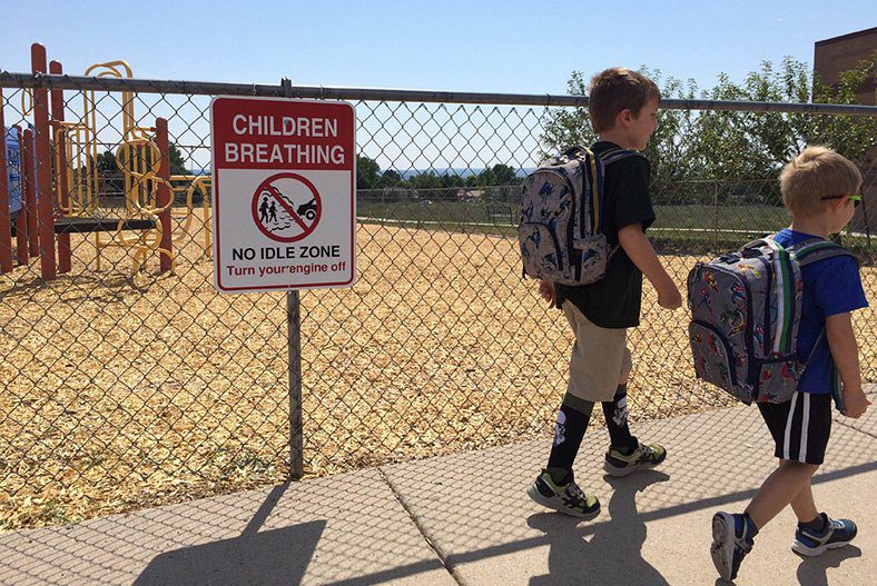 Kids walking through an Idle Free Zone at school