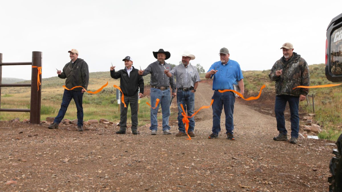 From left to right, Mike Canning (DWR), Gary Jenkins (MDF), Troy Justenson (SFW), Mike Laughter, Ron Camp (RMEF), and Todd Adams (DNR)cut the ribbon at Cinnamon Creek WMA.