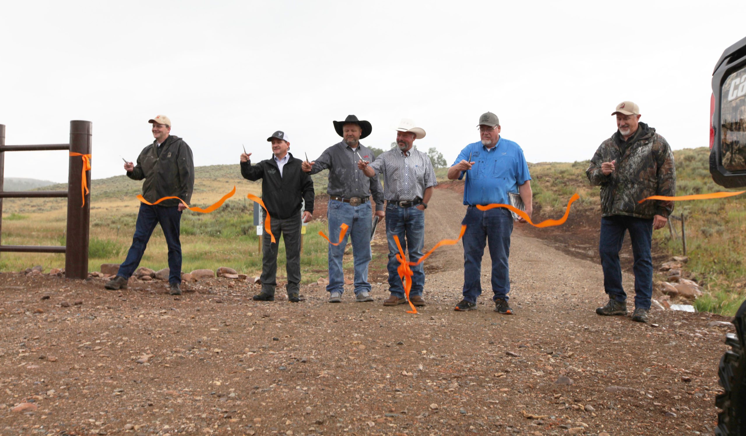 From left to right, Mike Canning (DWR), Gary Jenkins (MDF), Troy Justenson (SFW), Mike Laughter, Ron Camp (RMEF), and Todd Adams (DNR)cut the ribbon at Cinnamon Creek WMA.