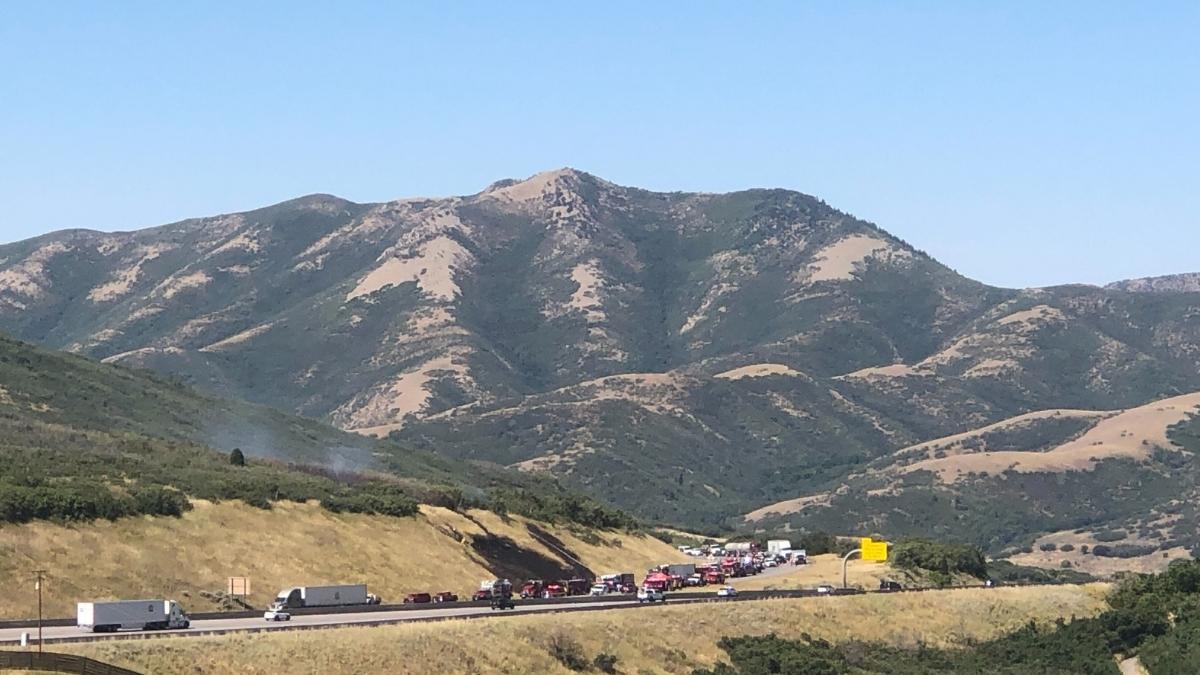 A vehicle fire spread to a wildfire in Parley's Canyon on I80 on Tuesday.