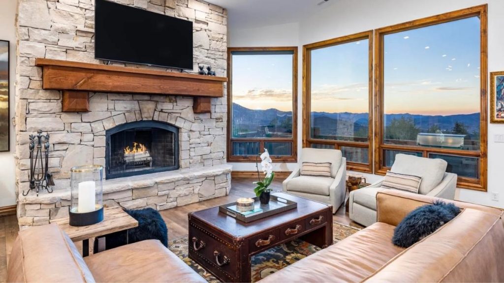 Living area fireplace with views.