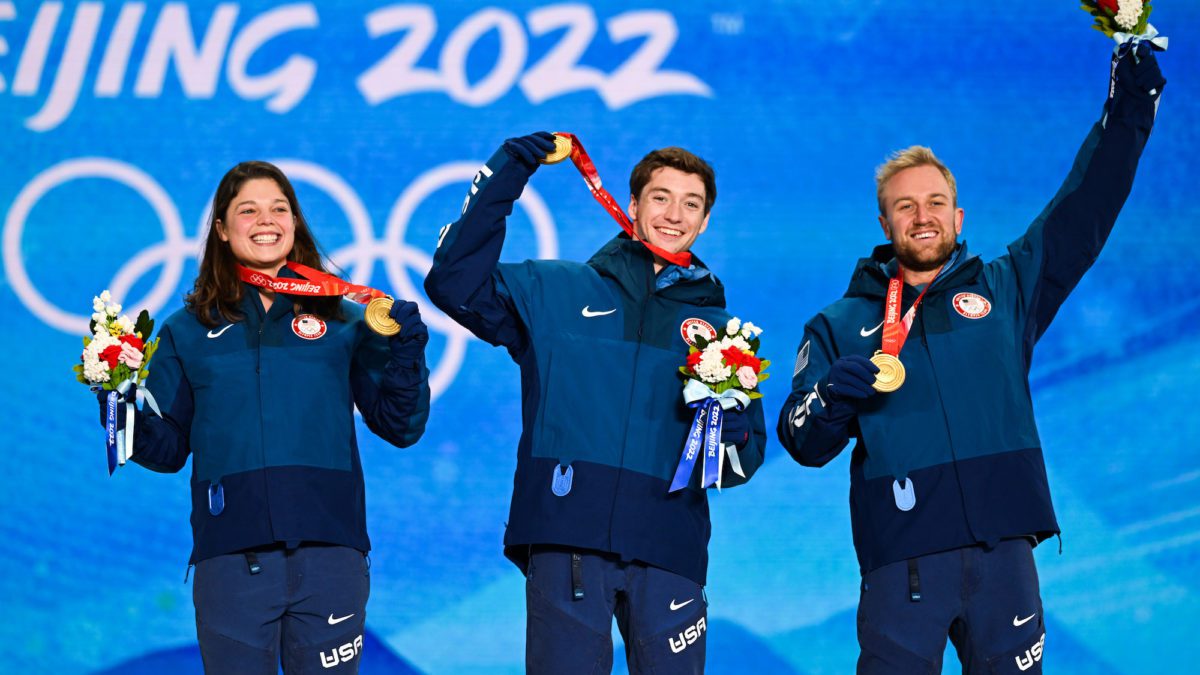 (L - R) Gold medallists Ashley Caldwell, Christopher Lillis and Justin Schoenefeld of Team United States celebrate during the Freestyle Skiing Mixed Team Aerials medal ceremony on Day 7 of the Beijing 2022 Winter Olympic Games at Zhangjiakou Medal Plaza on February 11, 2022 in Zhangjiakou, Hebei Province of China.