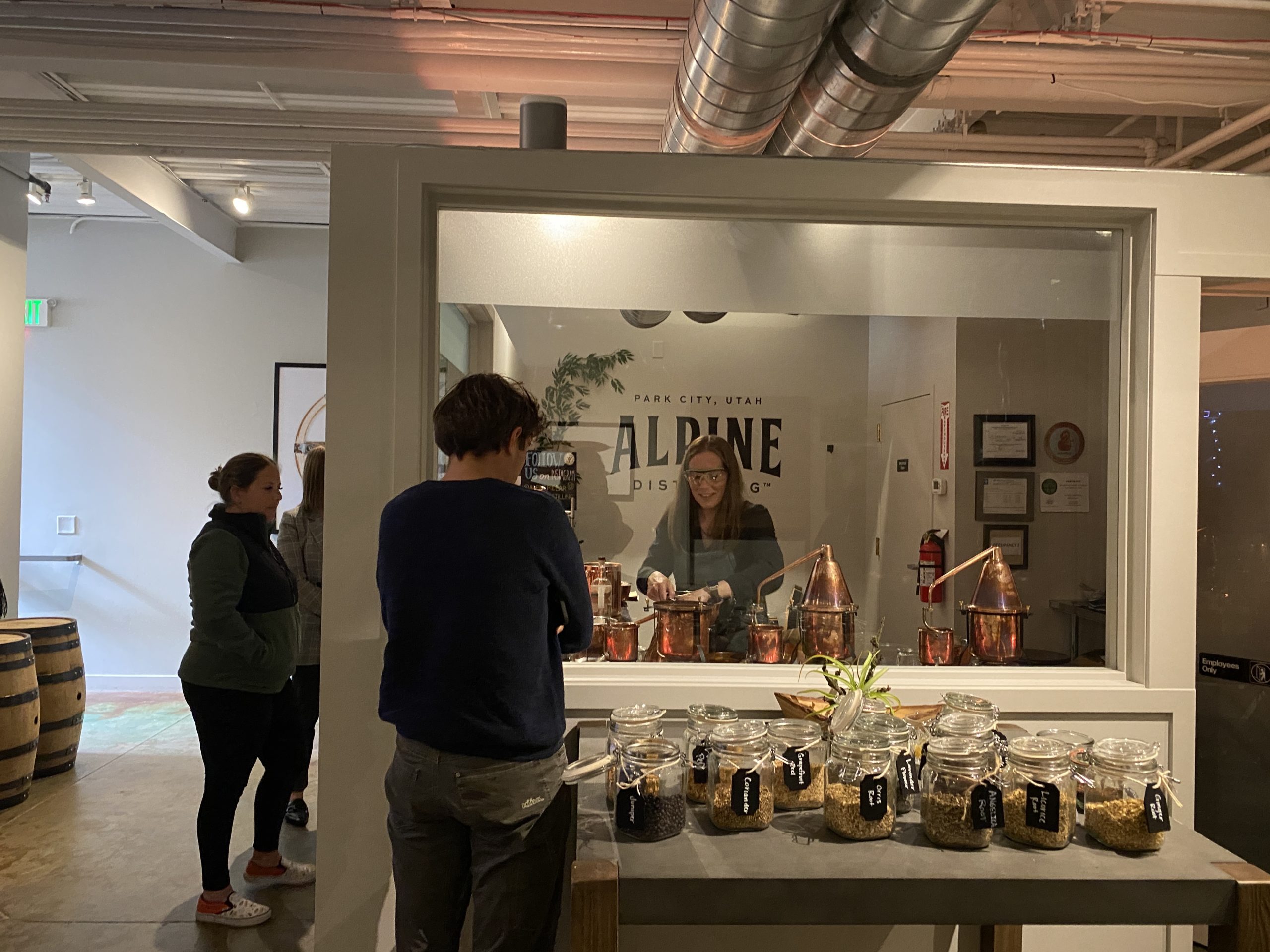 Sara Sergent (center), head of everything gin at Alpine Distilling distills custom made gin in custom-made copper sills at its location on Main Street.