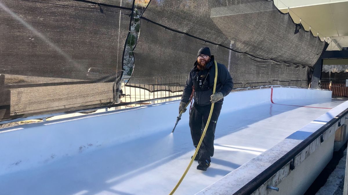 Track Crew member Ryan Krusi spritzed the ice on Park City's sliding track for the first of many times this winter.