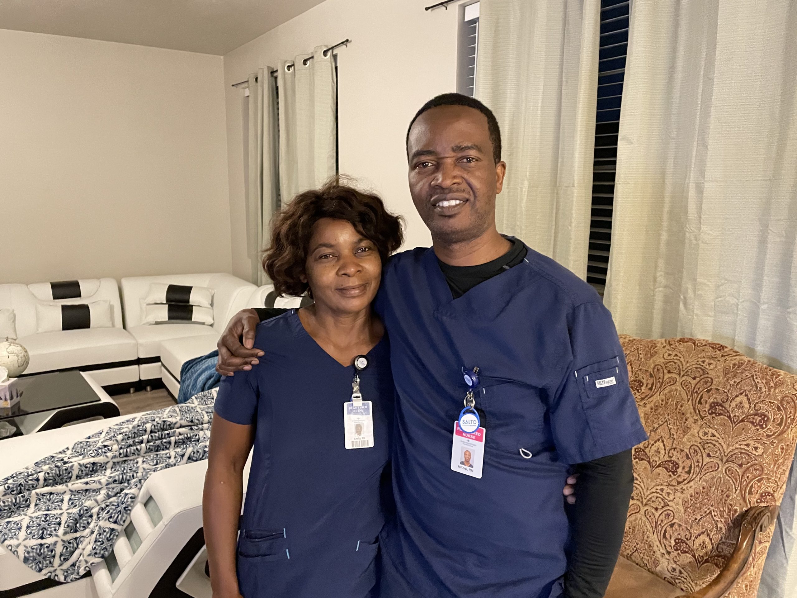 Emily and Nkosi Mlupi dressed for work at the Park City Hospital.