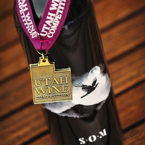 Bottle of S.O.M with medal from 2022 Utah Wine Festival