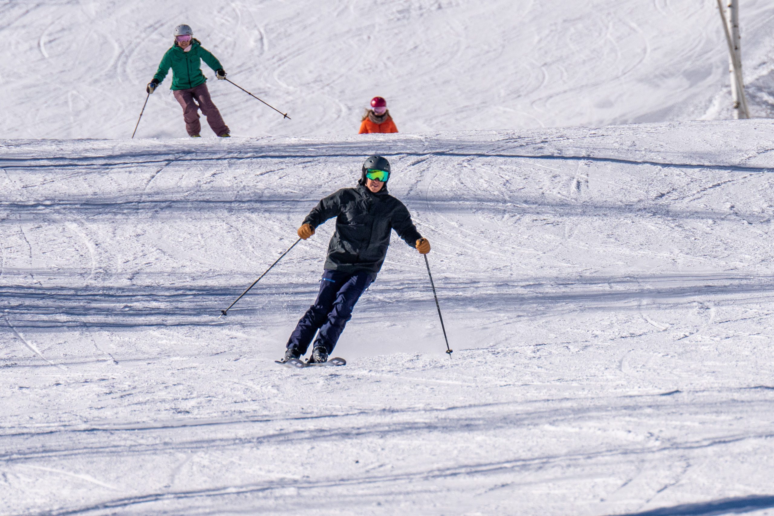 Skiers on the run Snow Dancer at PCMR.