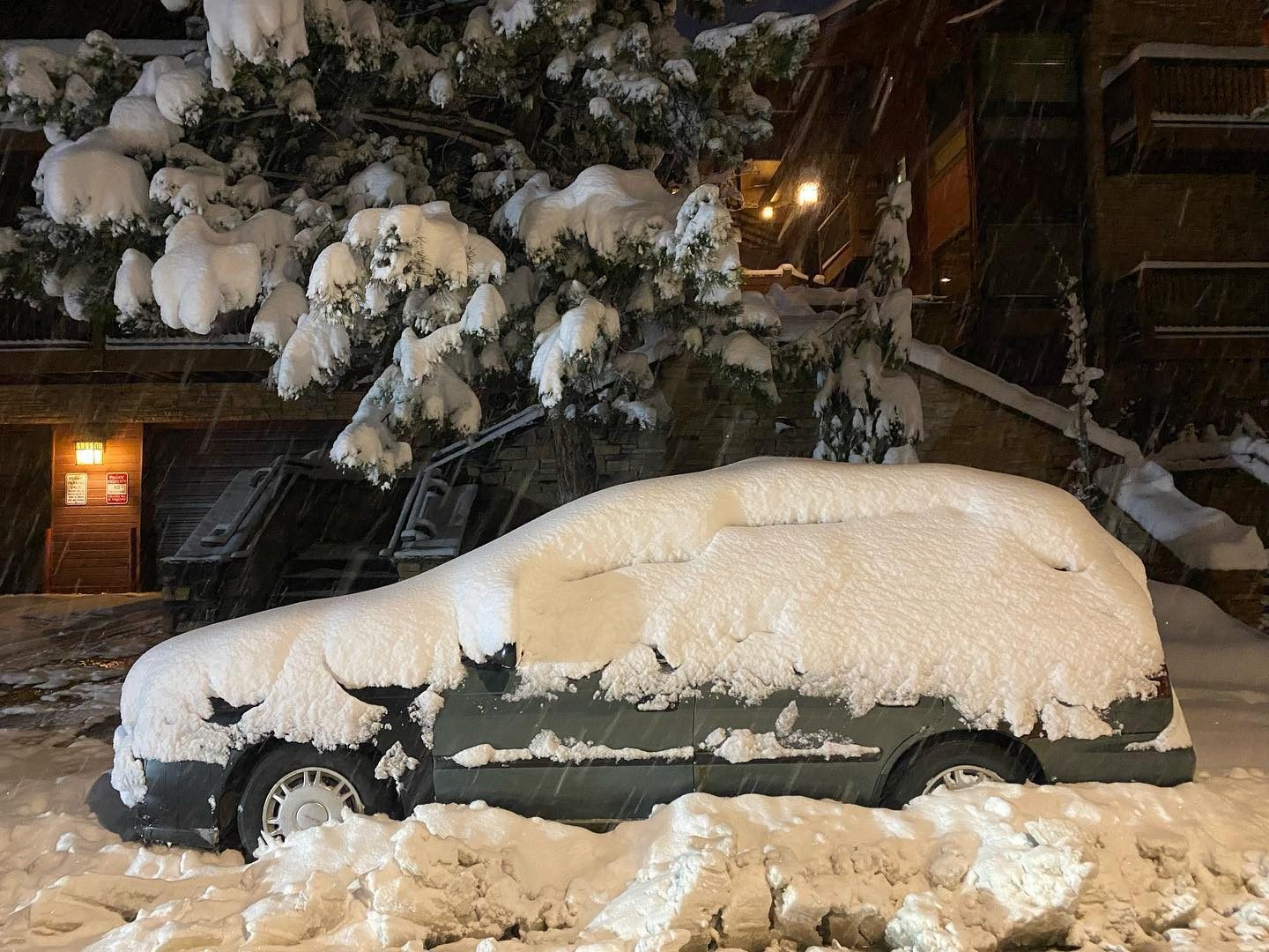 Snow covered car in Park City from recent storm