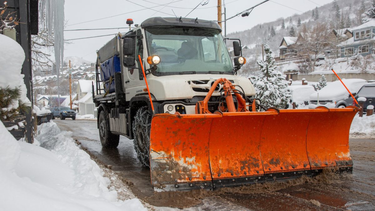 Park City Public Works snow plow clearing street.