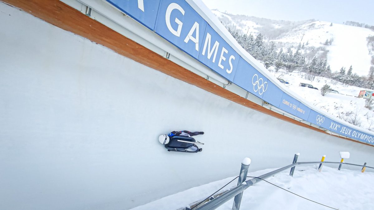 A luge sled literally and figuratively on the edge at the 2022 FIL World Cup at the Utah Olympic Park in Park City.